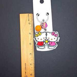 Hello kitty keychain with bead , love charm